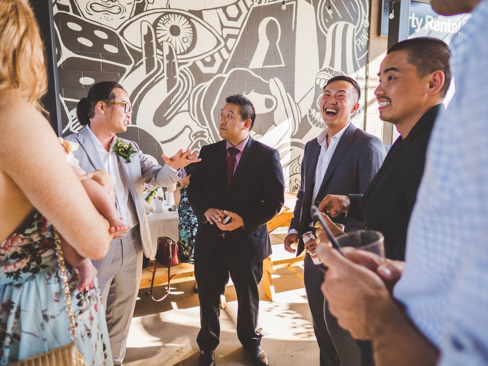 John Ha performing close-up magic for guests at a Vancouver event reception