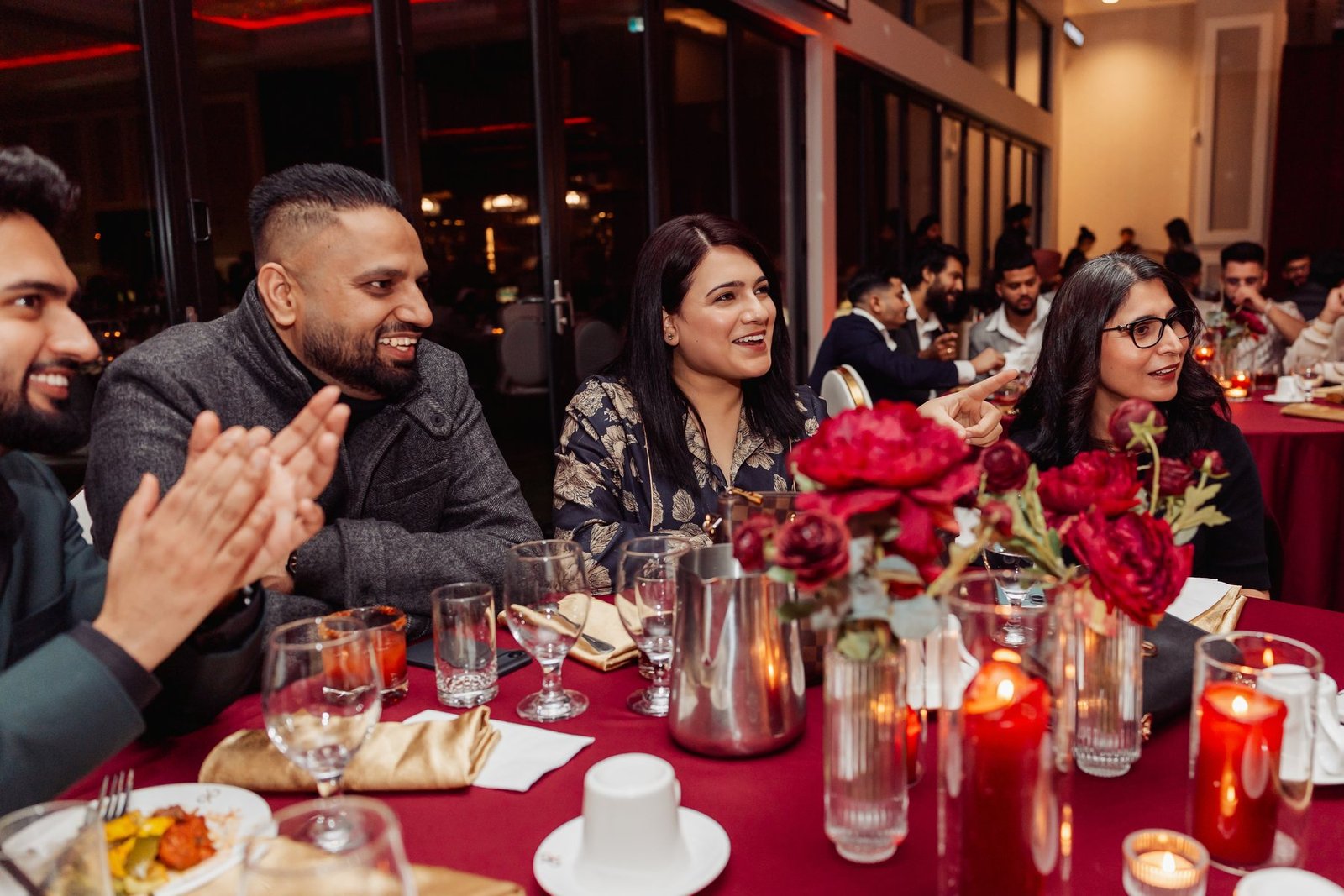 John Ha performing close-up magic for guests at a Vancouver employee appreciation dinner