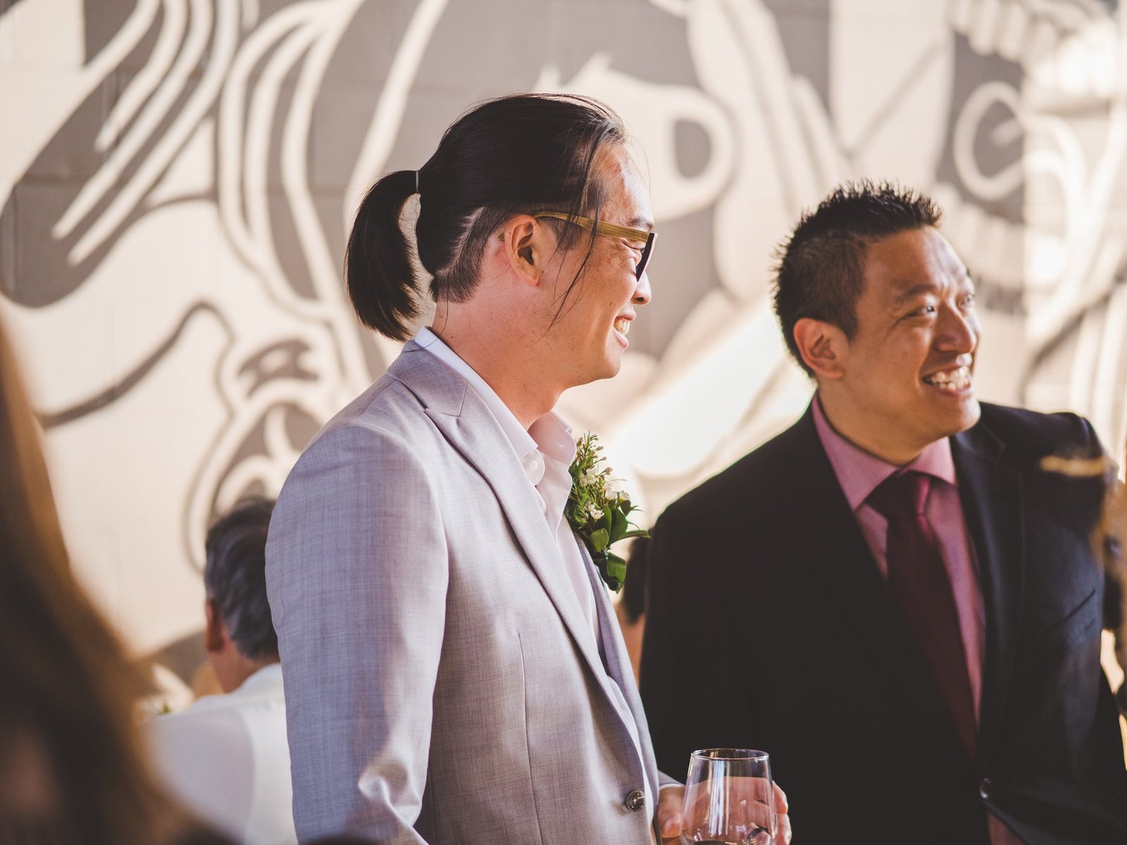 Corporate guests gathered around close-up magic at a Vancouver networking event