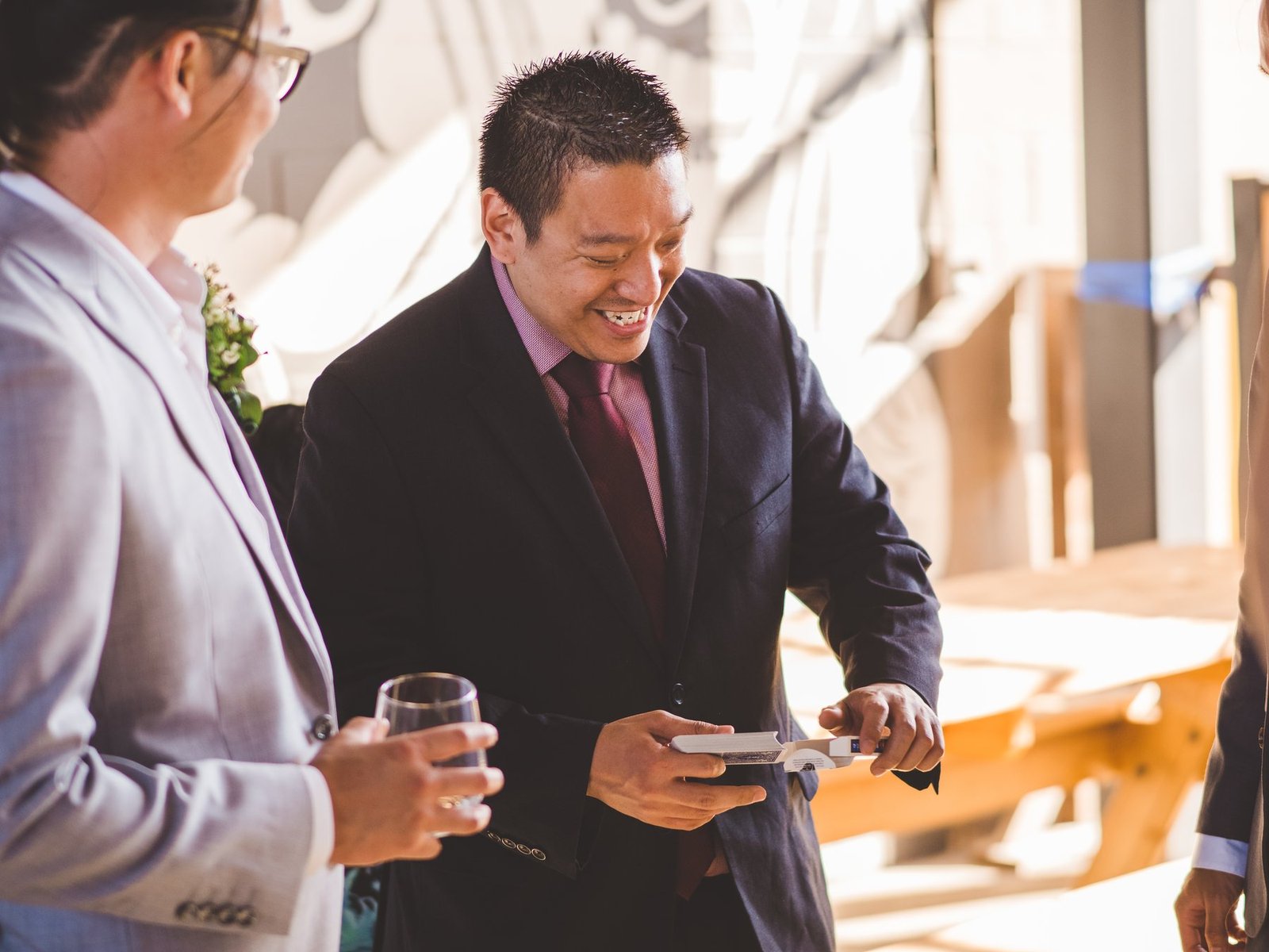John Ha performing close-up magic for guests at an upscale Vancouver VIP reception