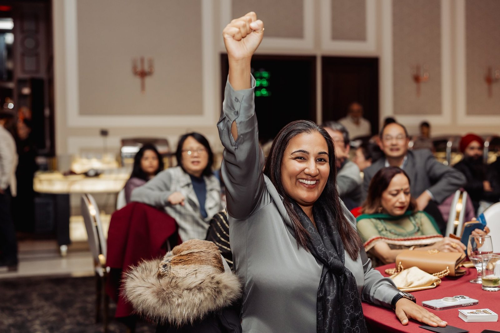 Audience member cheering during a John Ha performance