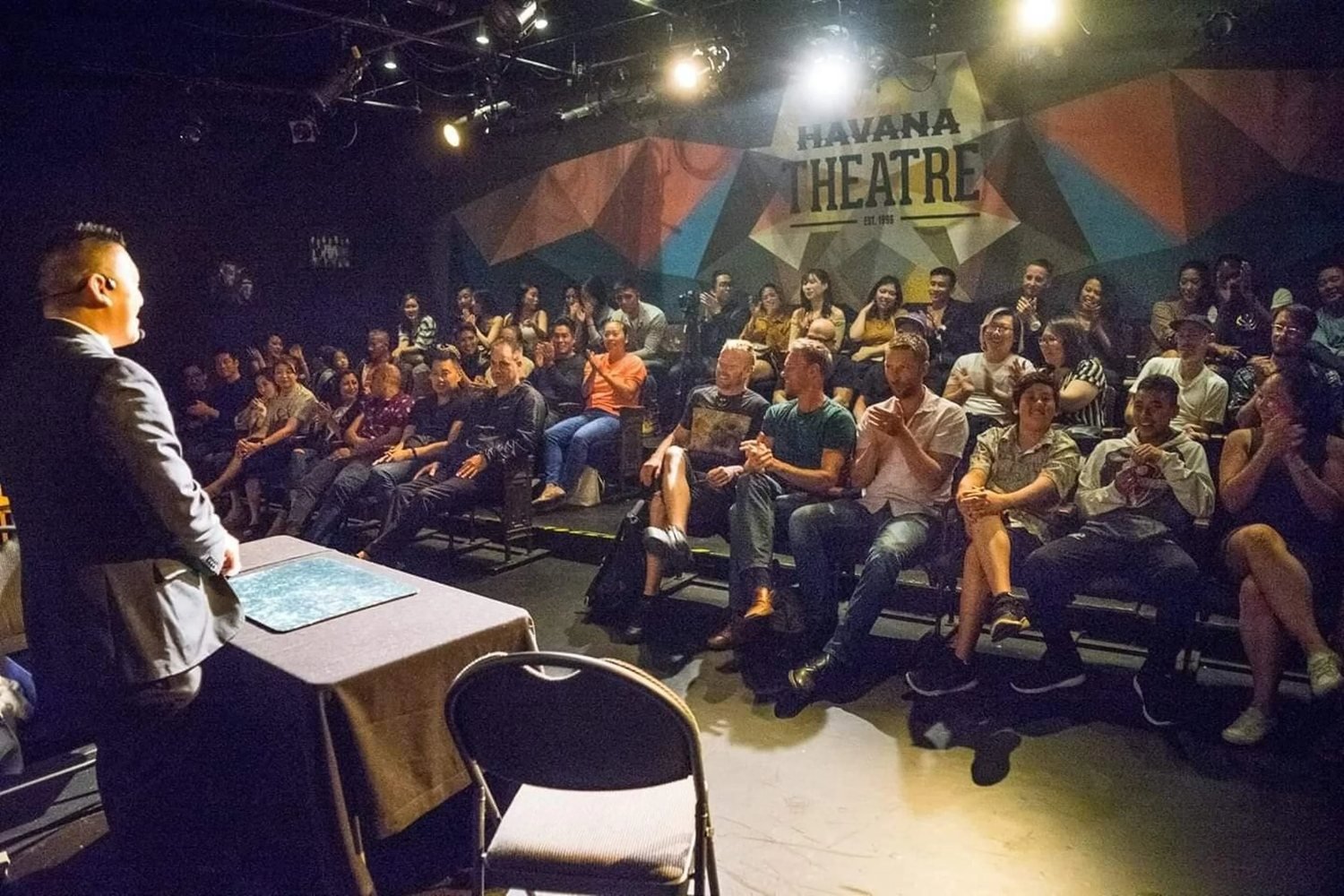 Audience watching a John Ha stage show