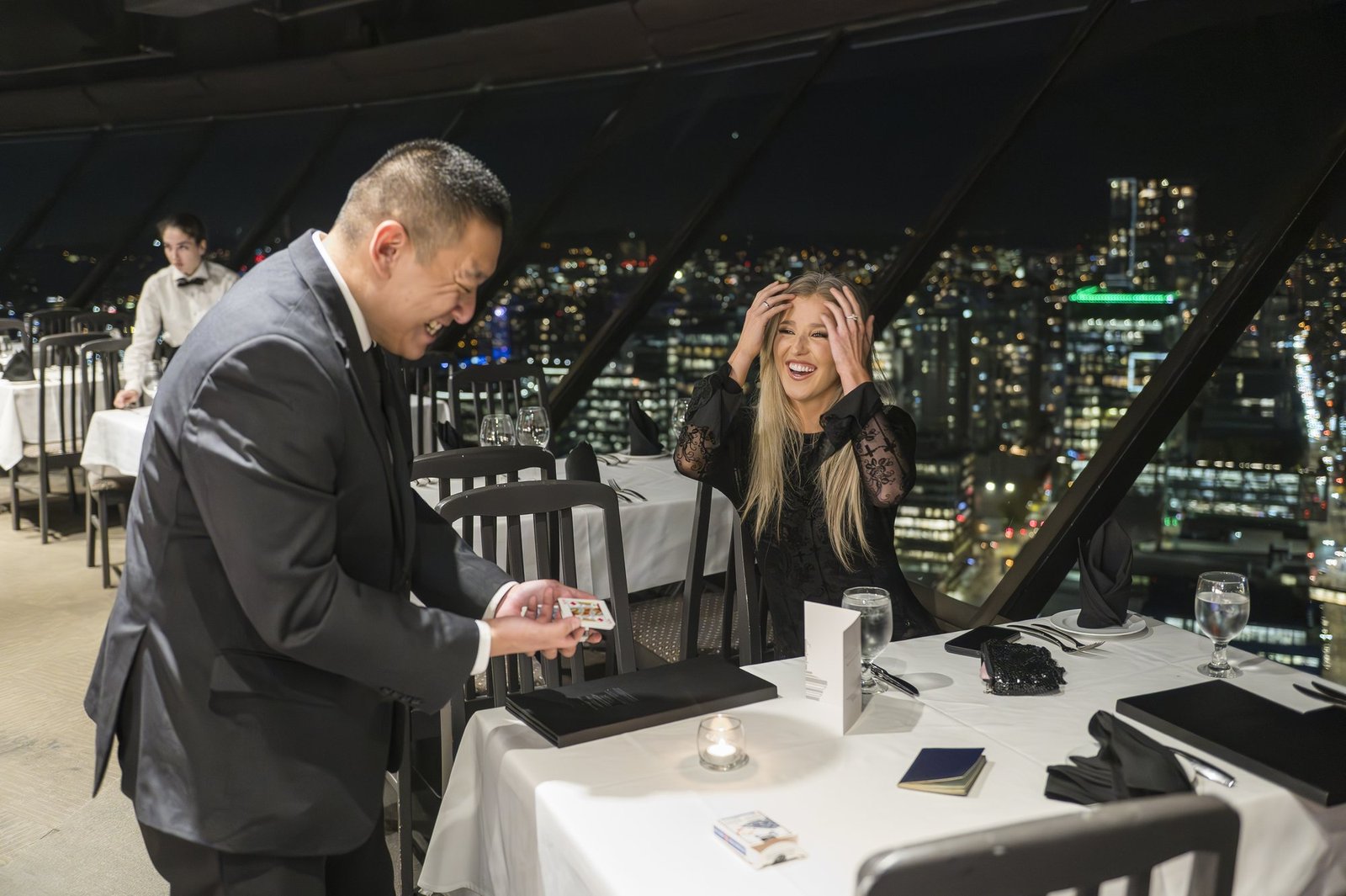 John performing VIP close-up magic beside the Vancouver skyline