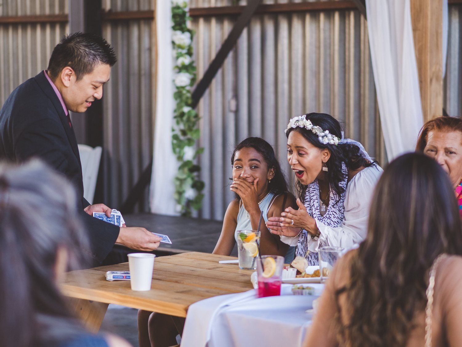 Guests smiling during close-up magic